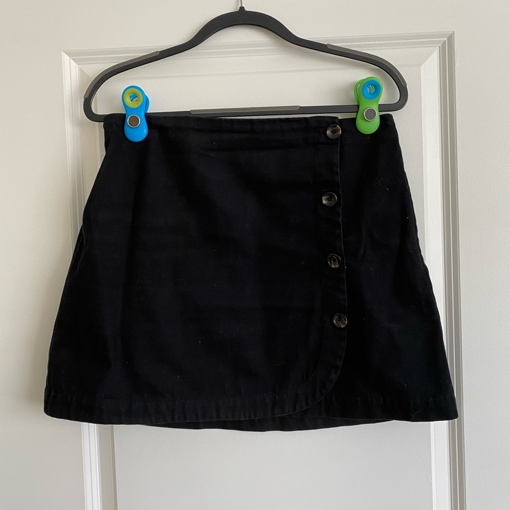 Black corduroy wrap skirt that buttons from Urban Outfitters